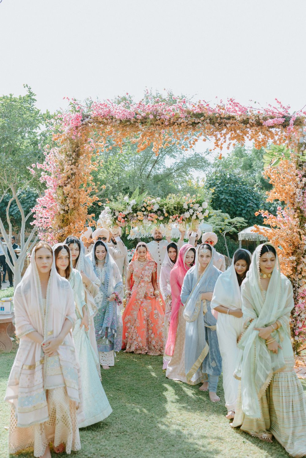 Photo of Bridal entry in coral lehenga on Anand Karaj