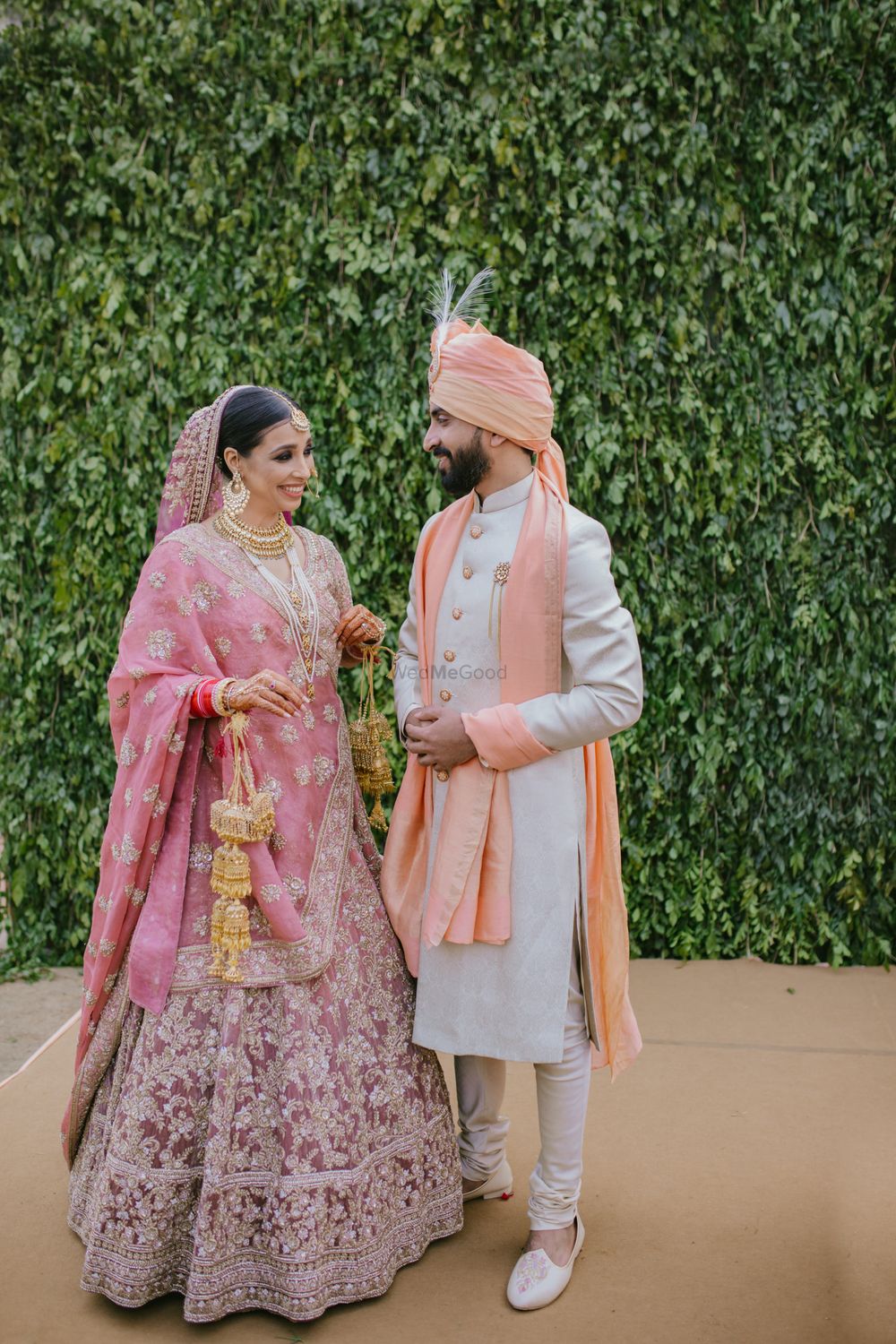 Photo of A bride and groom in coordinated clothes for the wedding