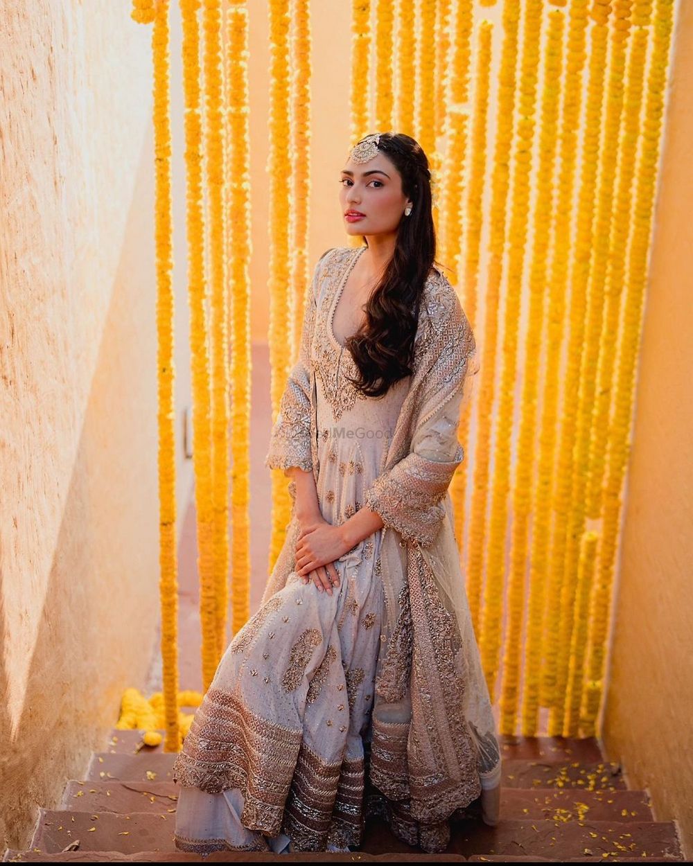 Photo of Athiya Shetty in gorgeous ivory cotton and intricate handmade gold gota work anarkali and gharara skirt for haldi