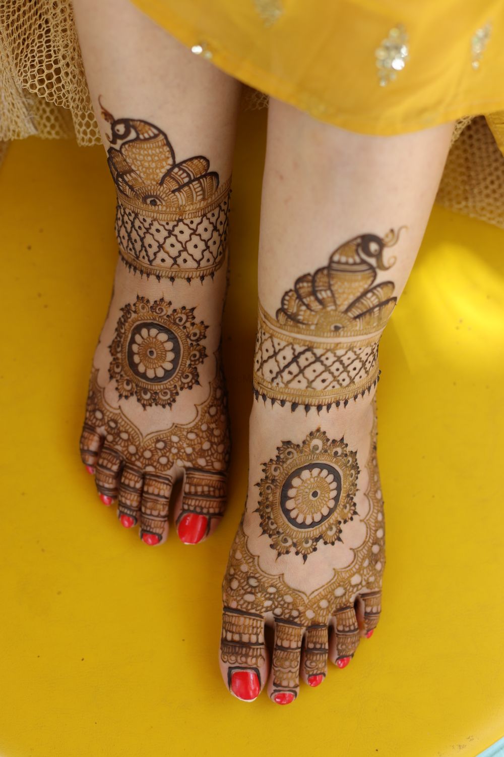 Photo of simple feet mehendi with mandala pattern