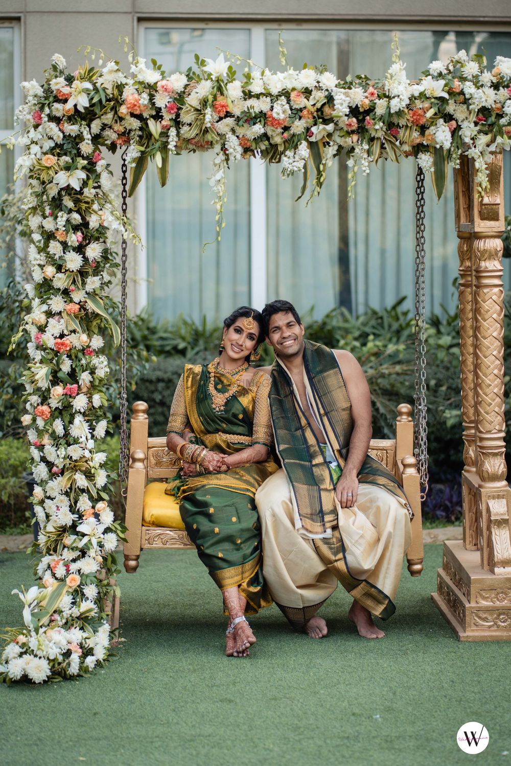 Photo of South Indian couple poses on a swing