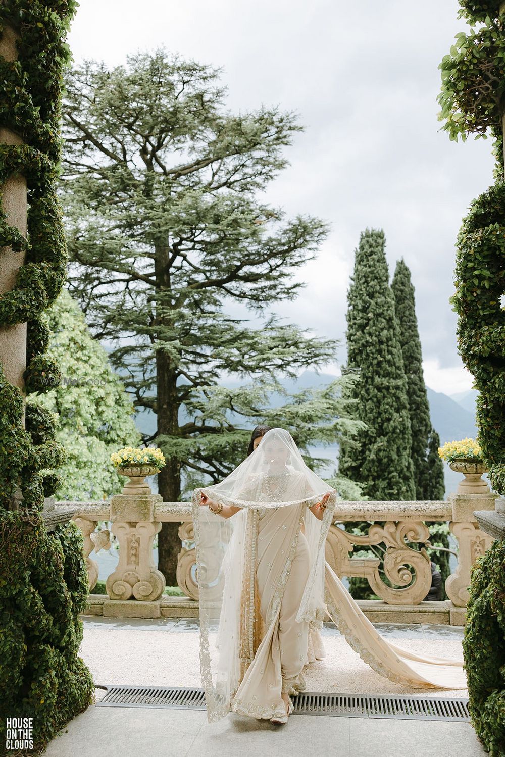 Photo of bride in white saree with veil