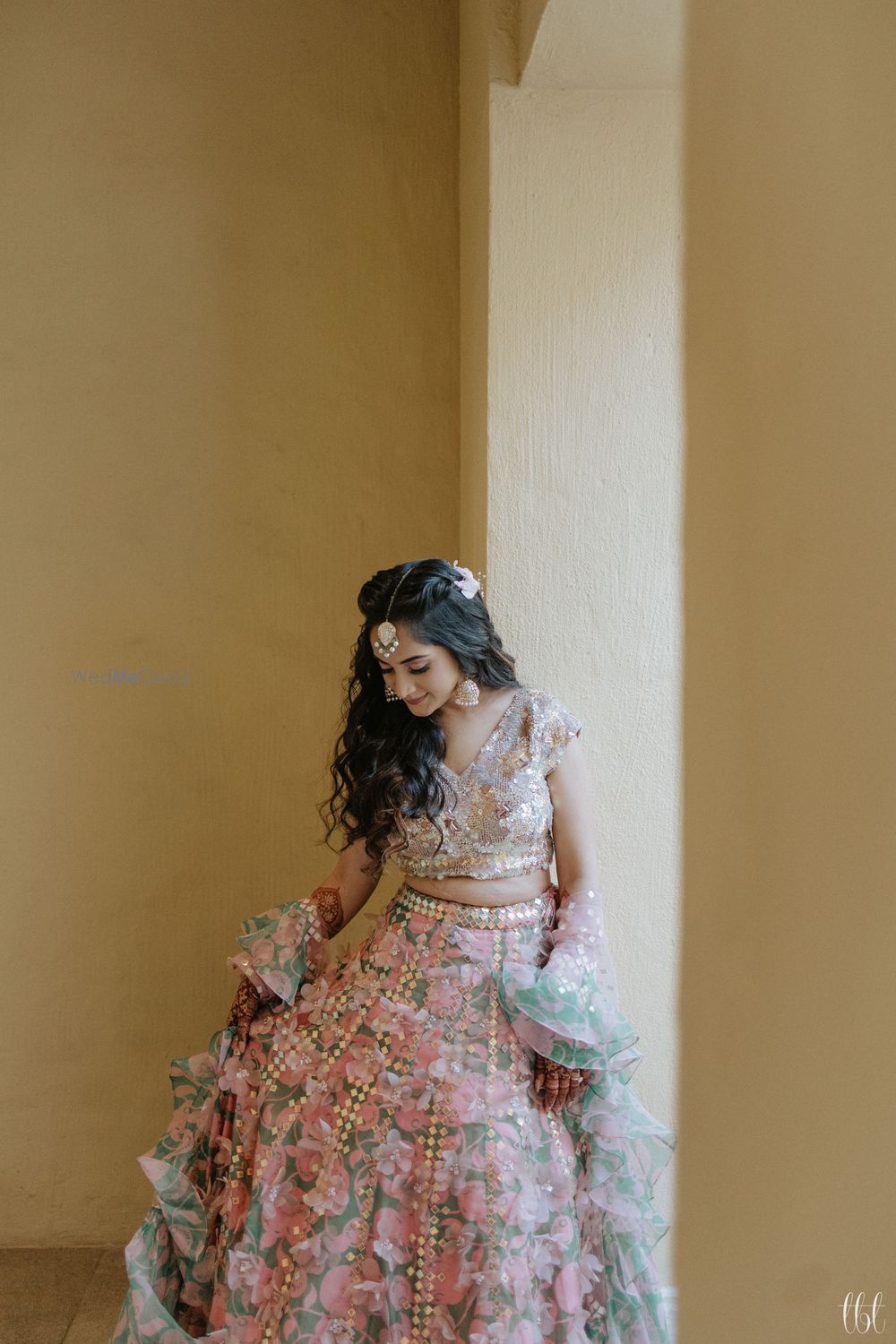 Photo of light pink mehendi lehenga with ruffled dupatta