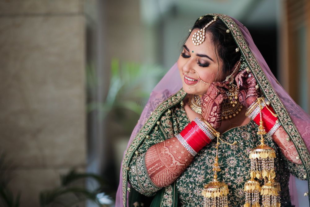 Photo of bride wearing jewellery on her wedding day shot