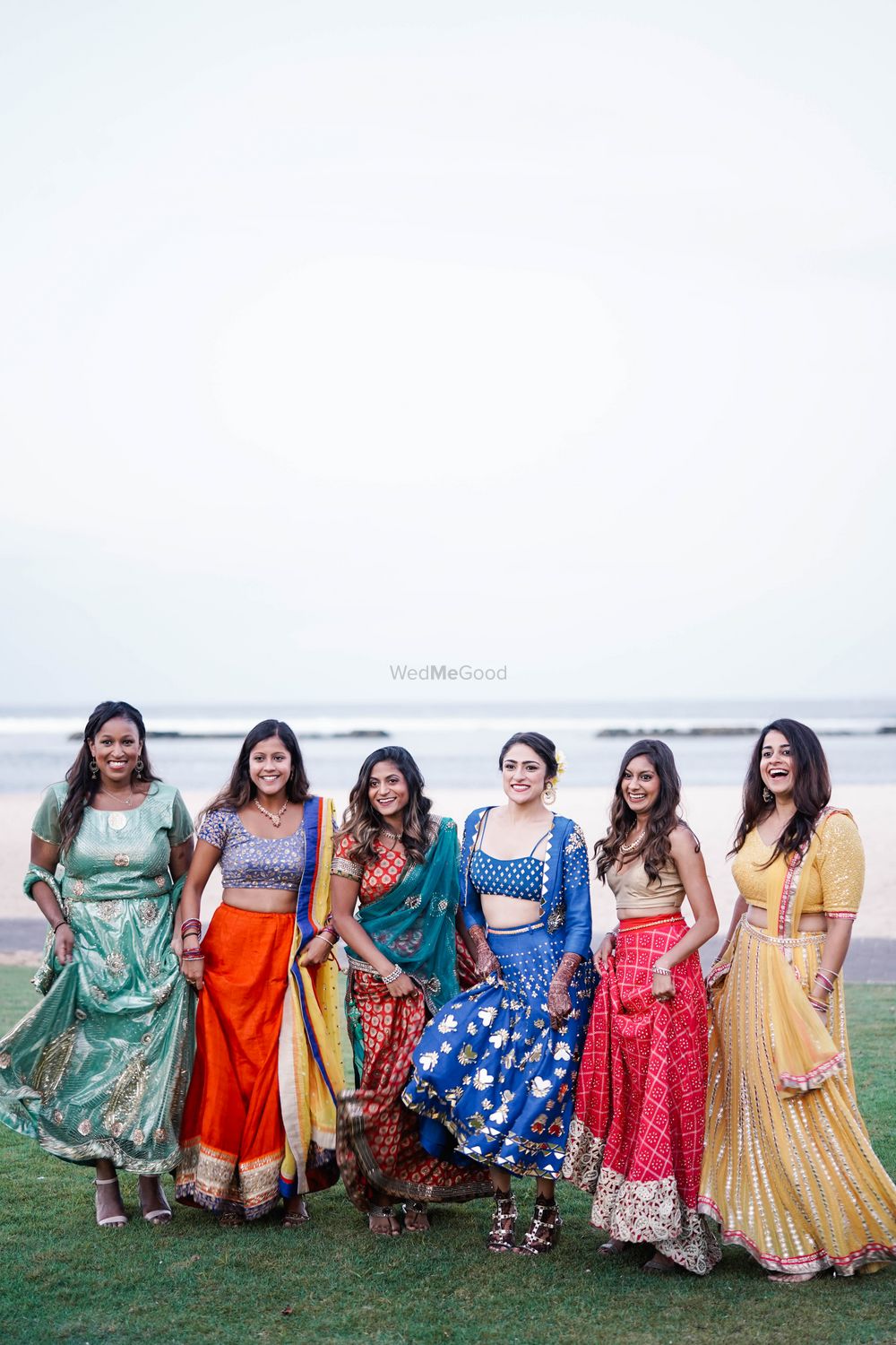 Photo of bride with her mismatched bridesmaids
