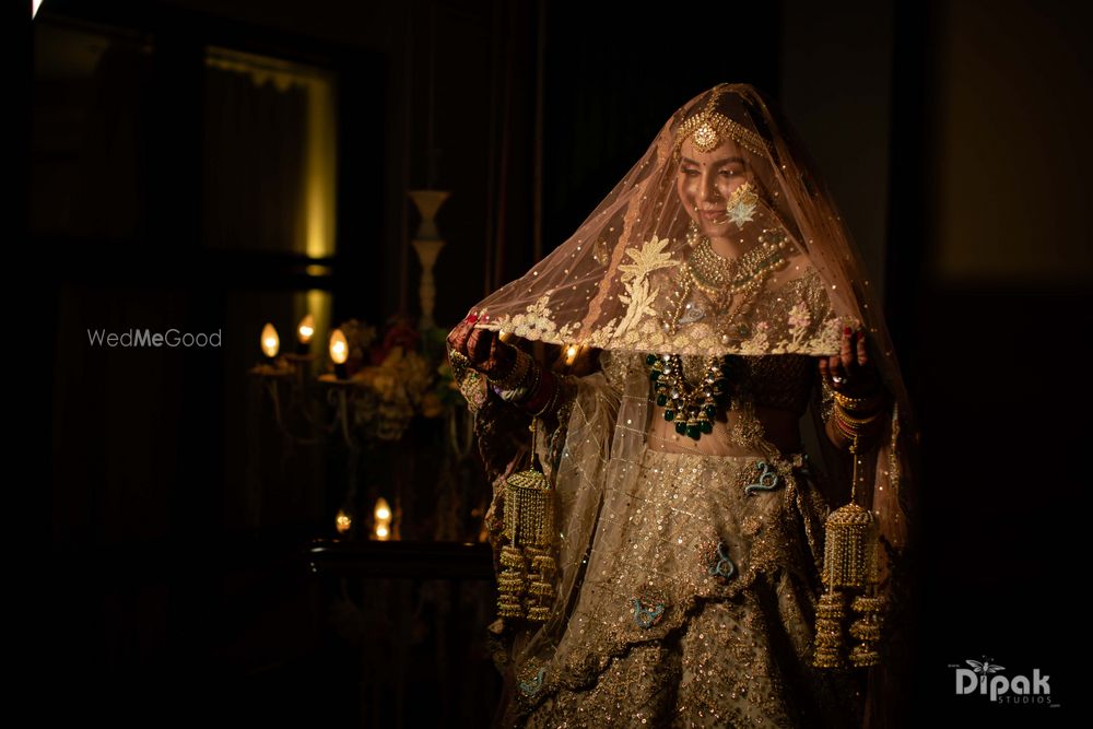 Photo of Bride holding her veil