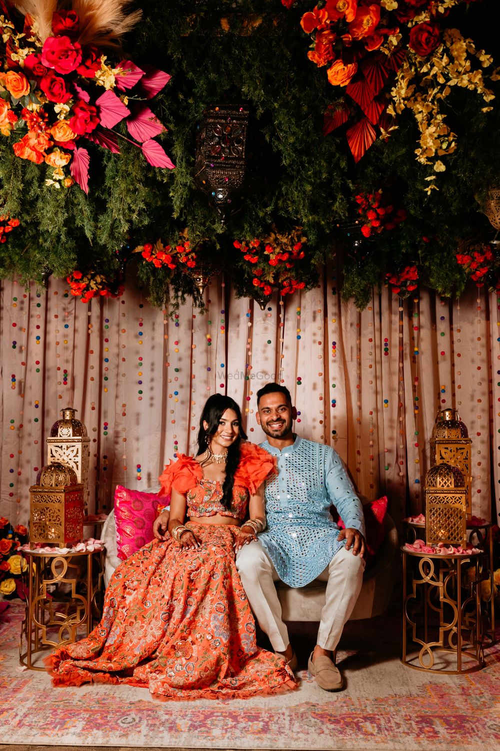 Photo of bright mehendi outfit ideas for bride and groom