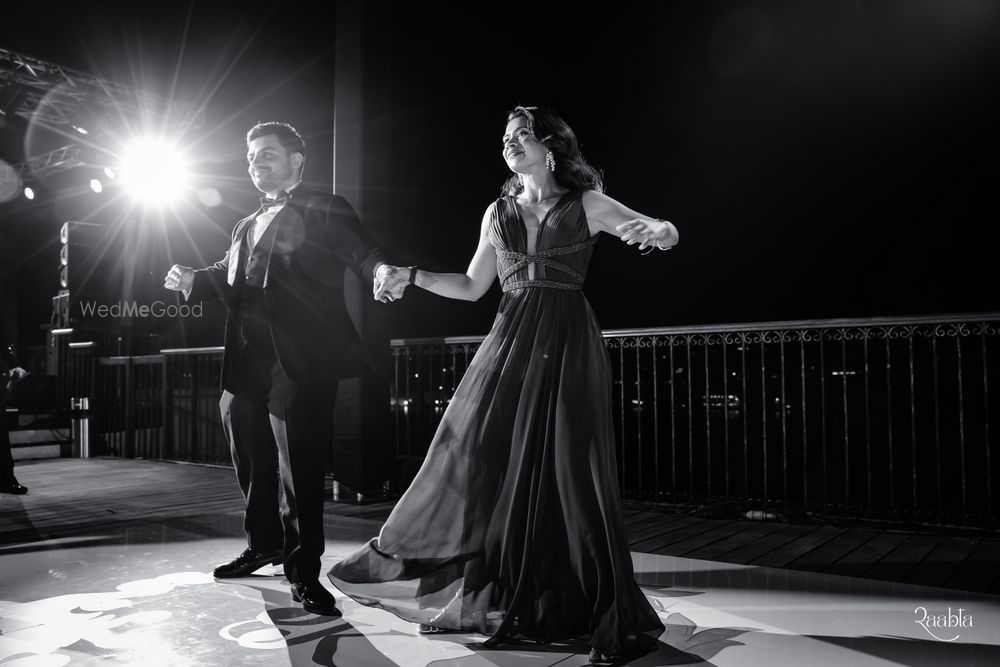 Photo of Cute capture of the bride and groom in black and white as they dance on their sangeet night