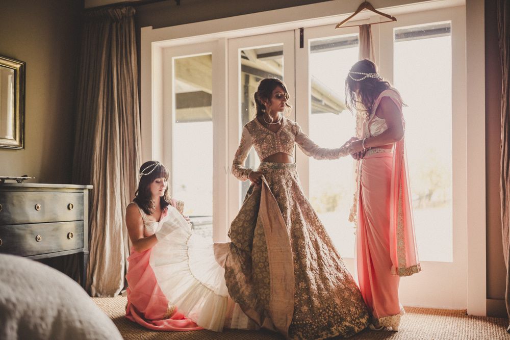 Photo of Indian bride getting ready in pastel lehenga