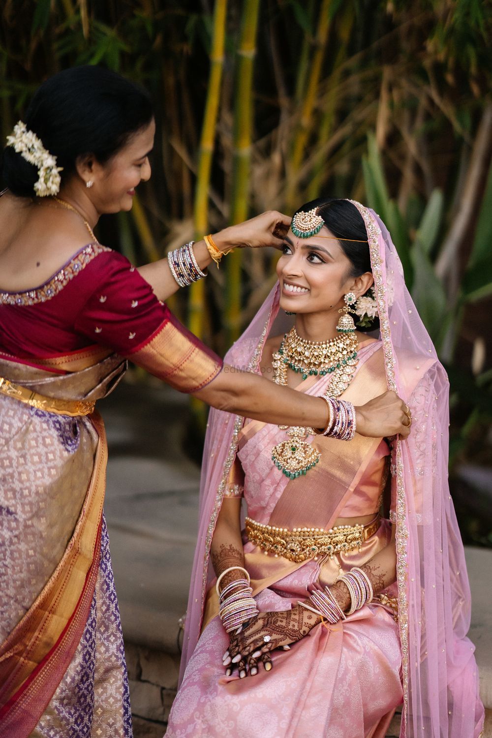 Photo of Bride in a pink kanjeevaram with her mother