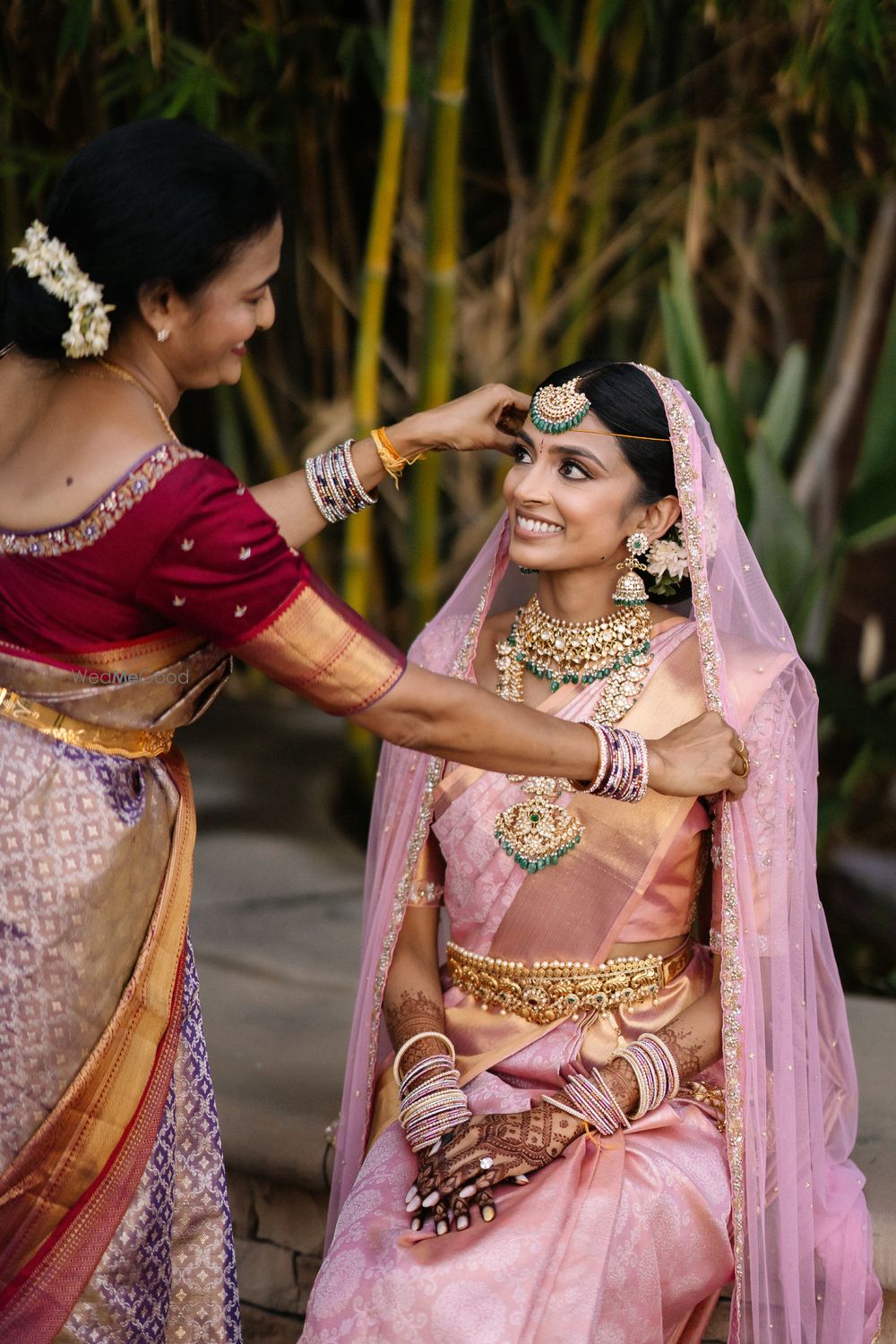 Photo of Bride in a pink kanjeevaram with her mother