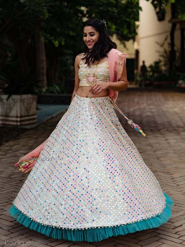 Photo of Mehendi or engagement lehenga with ruffled border