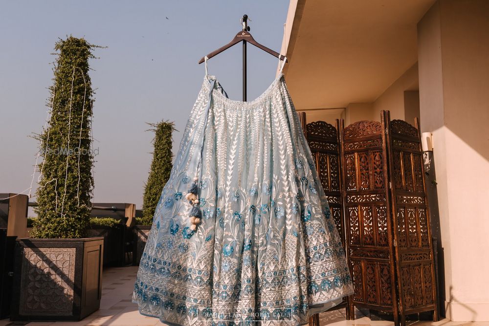 Photo of Pretty powder blue lehenga hanging shot