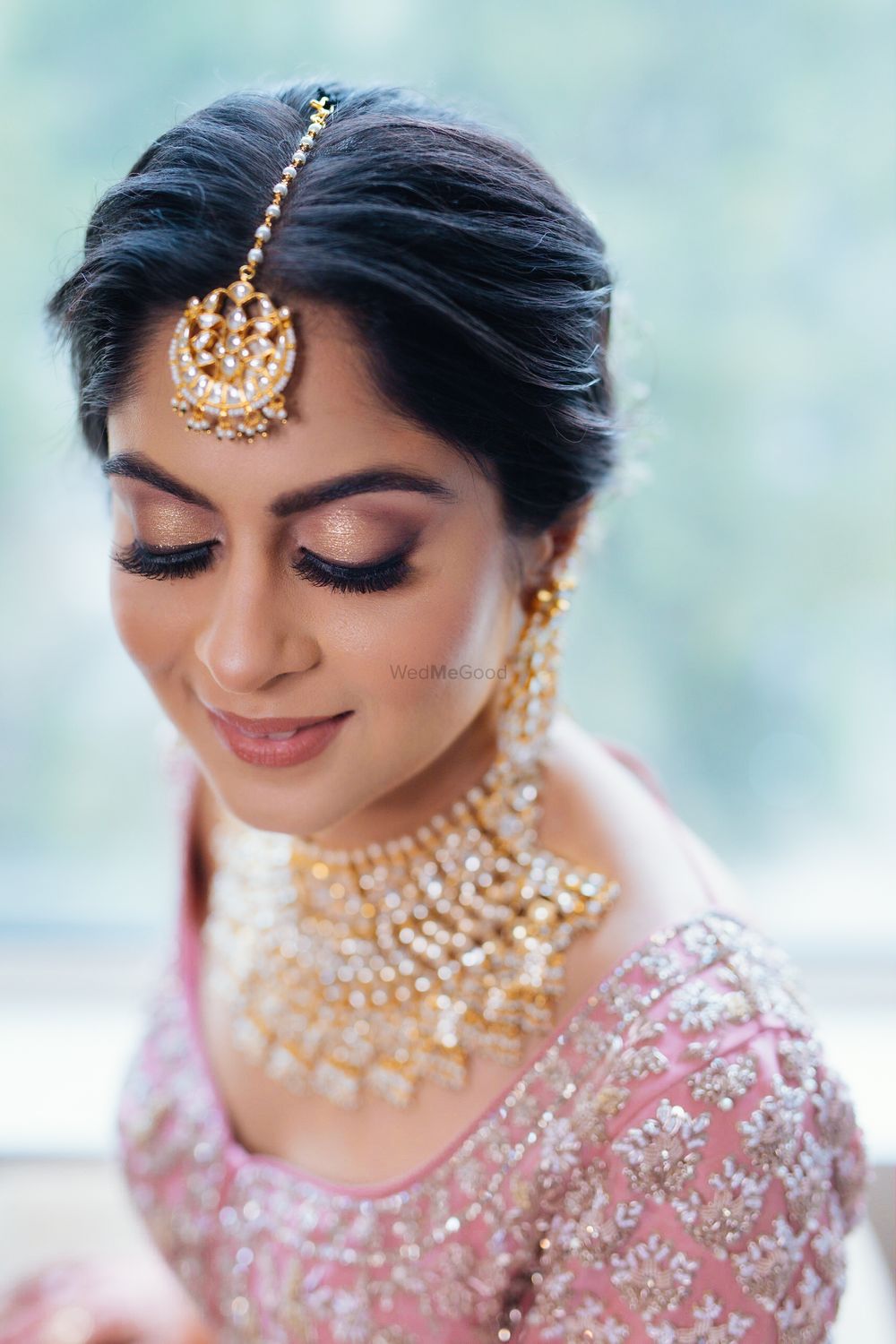 Photo of Bride wearing nude gold lids with fluttery lashes