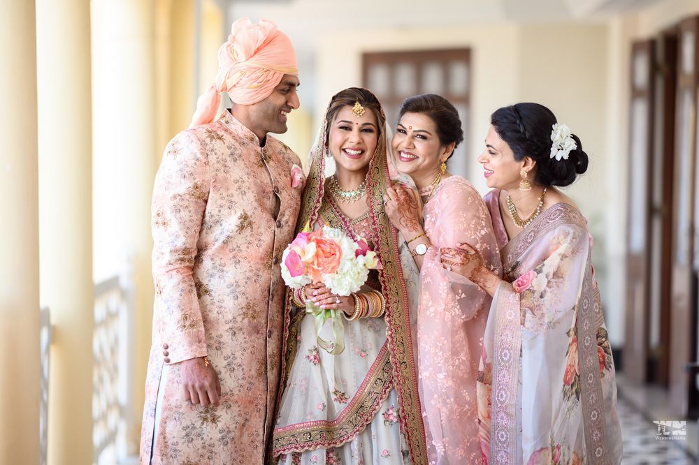 Photo of The bride and her family in coordinated floral outfits