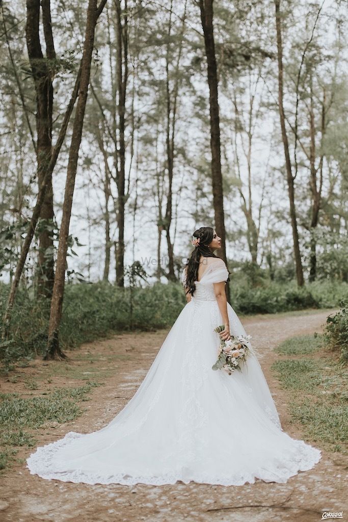 Photo of Pretty bride wearing white gown for Christian wedding