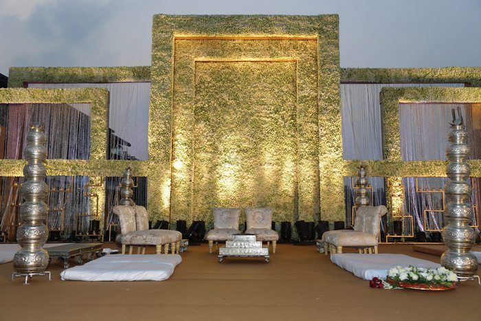 Photo of Stage decor in white with floral wall