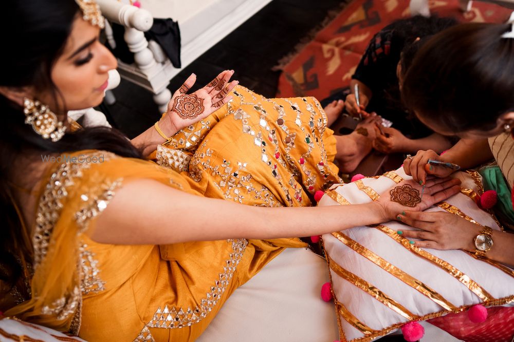 Photo of Bride getting her mehendi put.