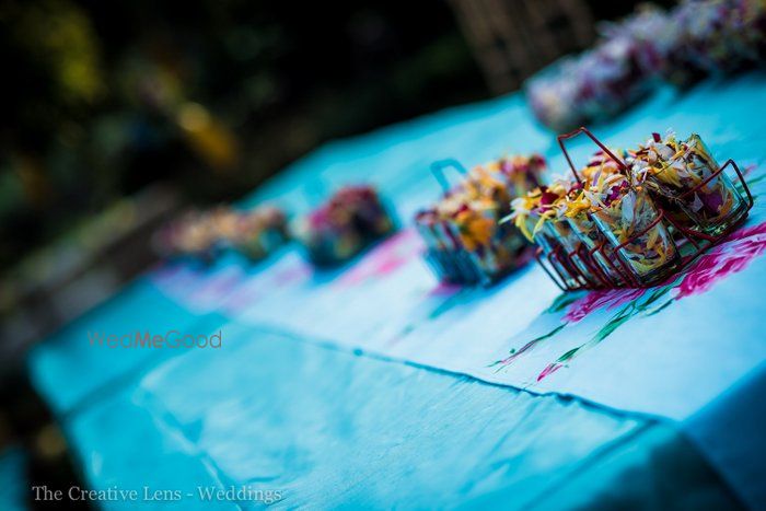 Photo of table centerpiece as chai ka glass with flowers