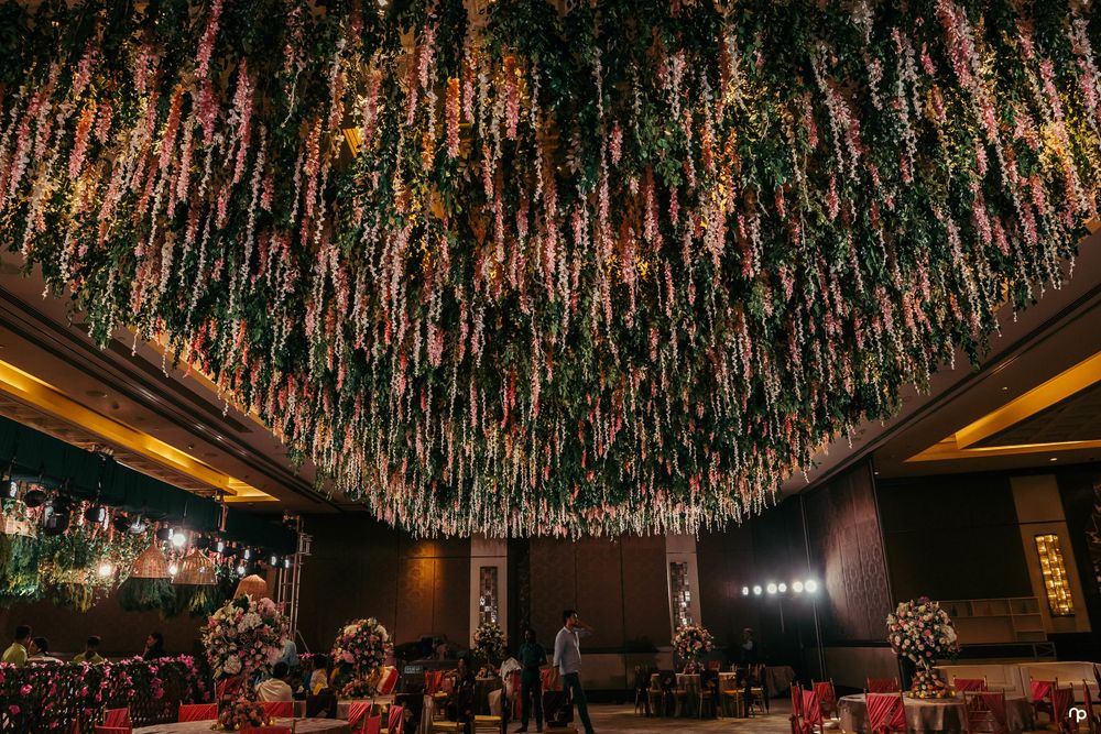 Photo of Grand engagement decor idea with floral ceiling