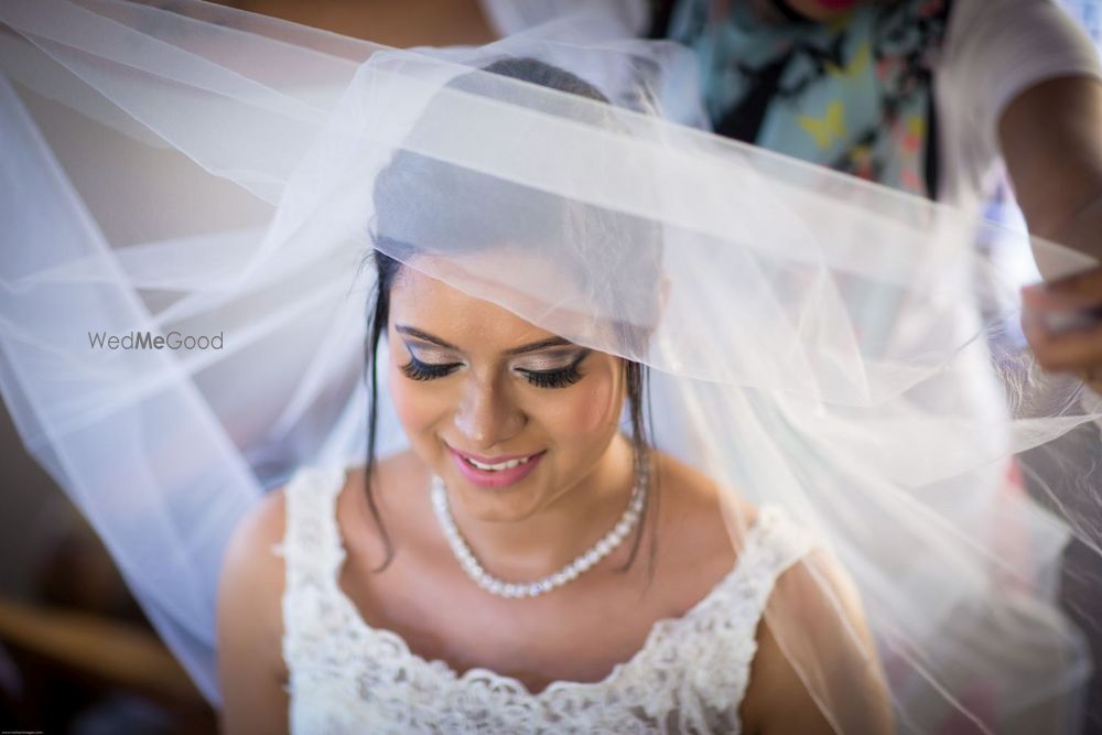 Photo of Christian Bride Wearing Her Veil Shot