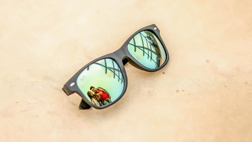 Photo of Pre wedding shot with reflection in sunglasses