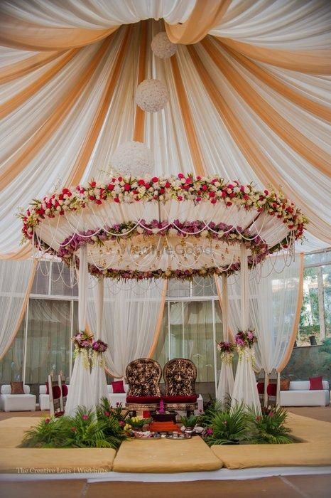 Photo of Canopy Drapes and Floral Wedding Decor