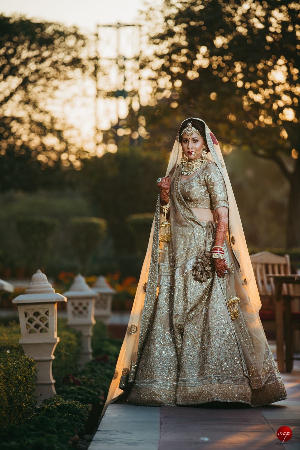 Photo of Shimmery gold bridal lehenga monotone