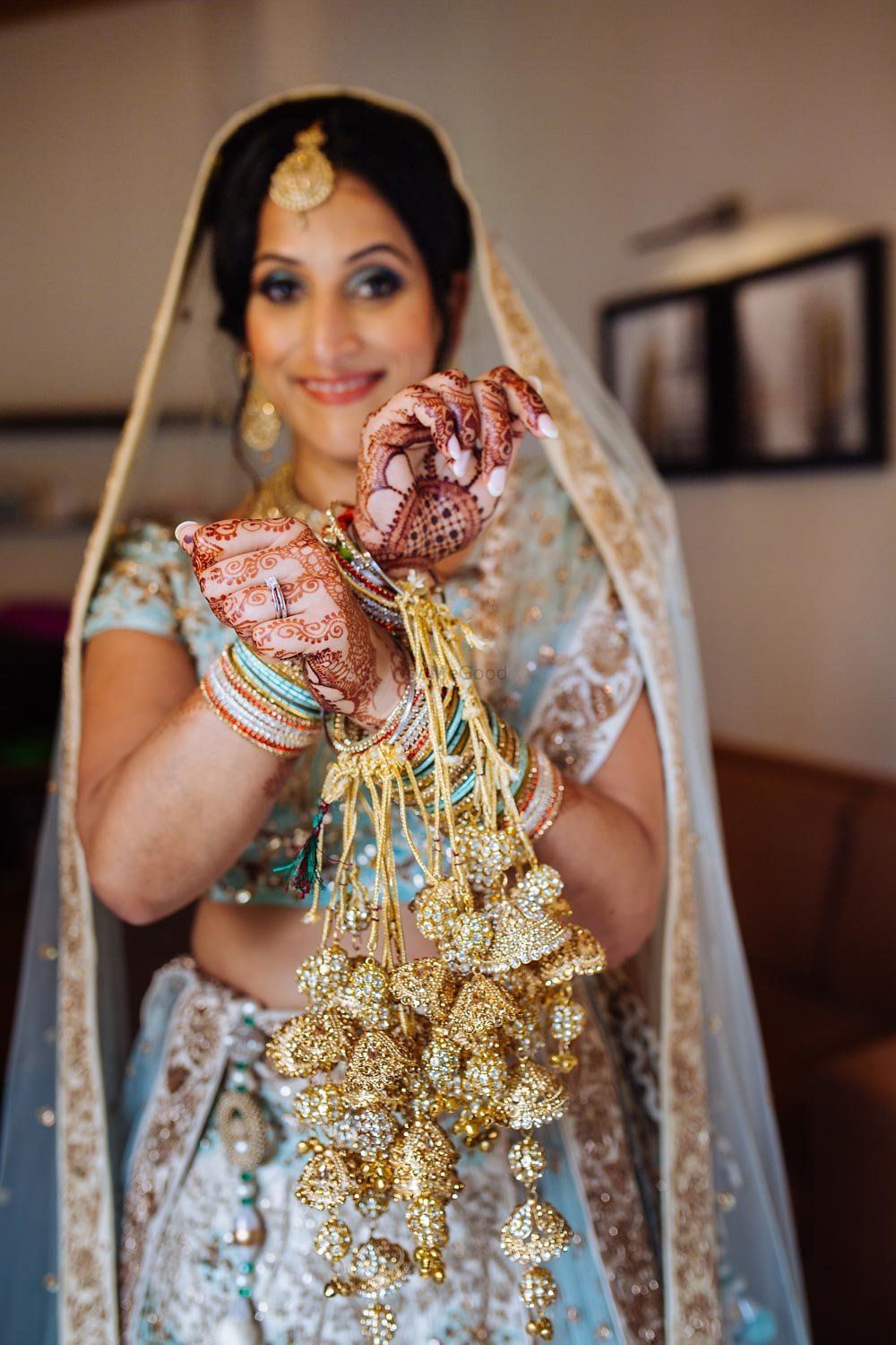 Photo of Bride showing off unique bridal kaleere