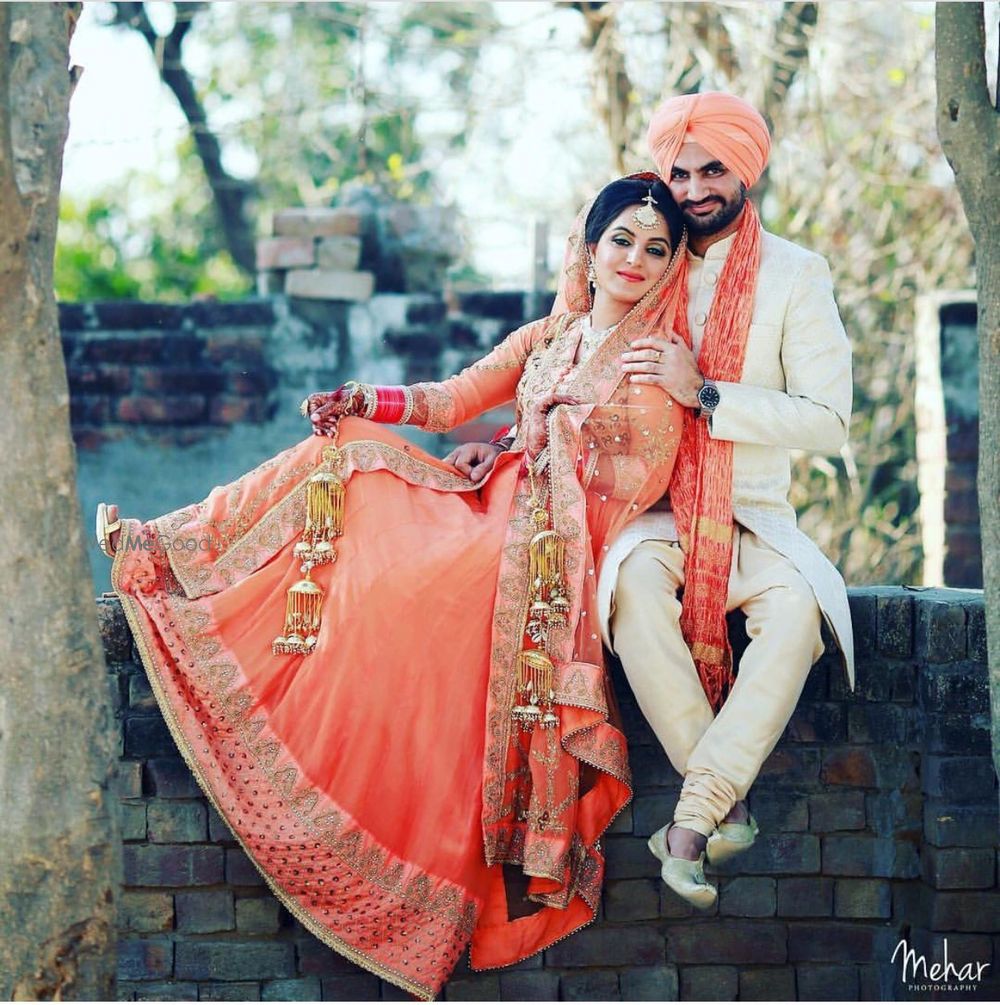 Photo of Bride in orange bridal anarkali