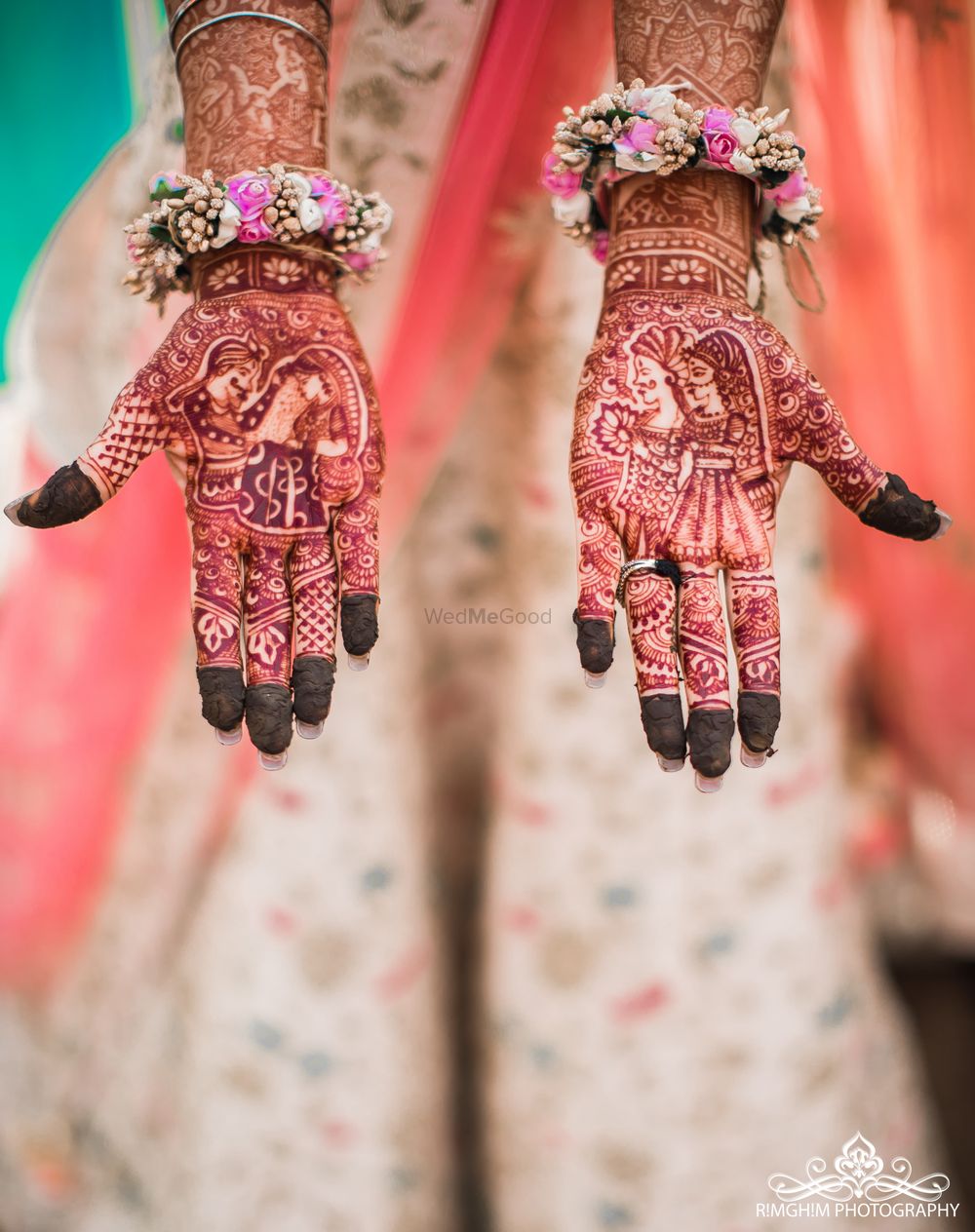 Photo of Mehendi hands with portraits and floral hand jewellery