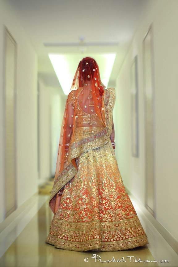 Photo of Gold and orange ombre bridal lehenga
