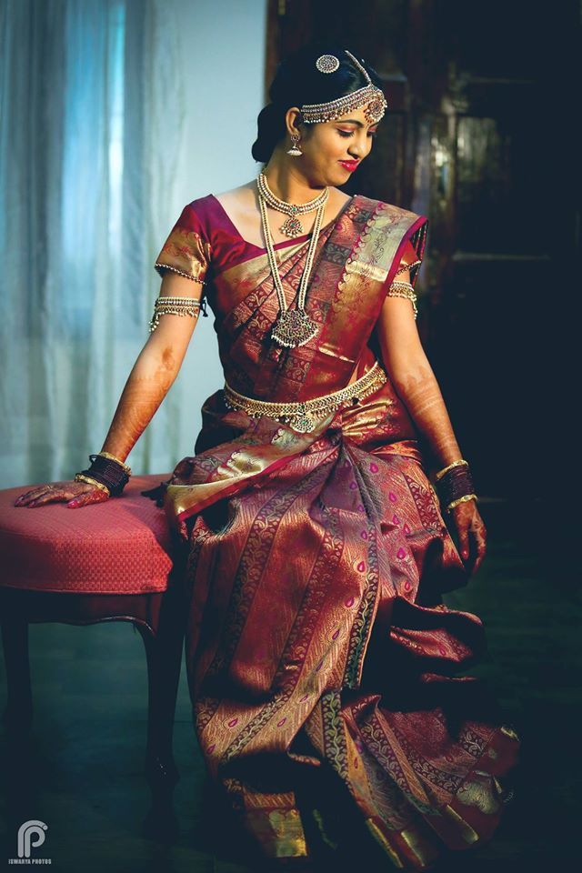 Photo of South indian bride in deep red kanjivaram saree