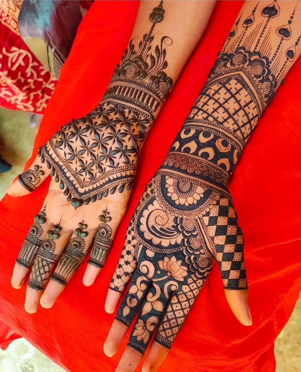 Photo of Mehendi design with jaal work and lotus motifs.