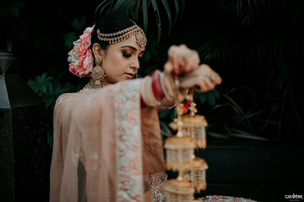 Photo of Bride posing with her kaleeras.