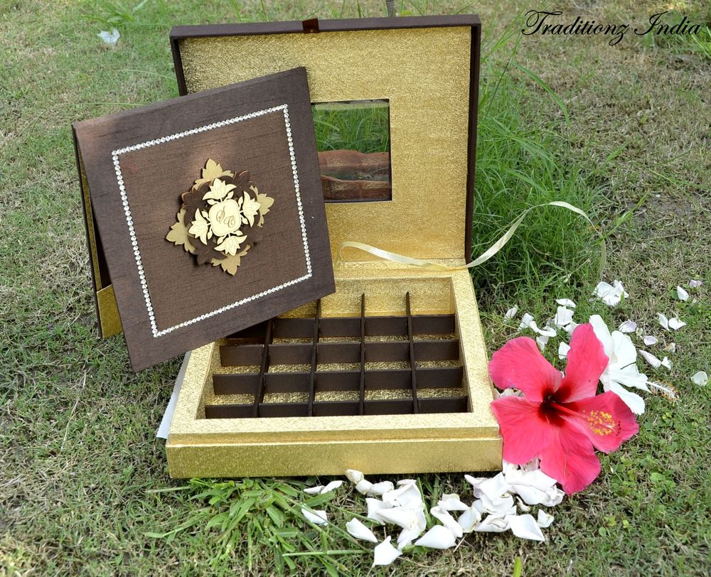 Photo of gold and brown invitation card box