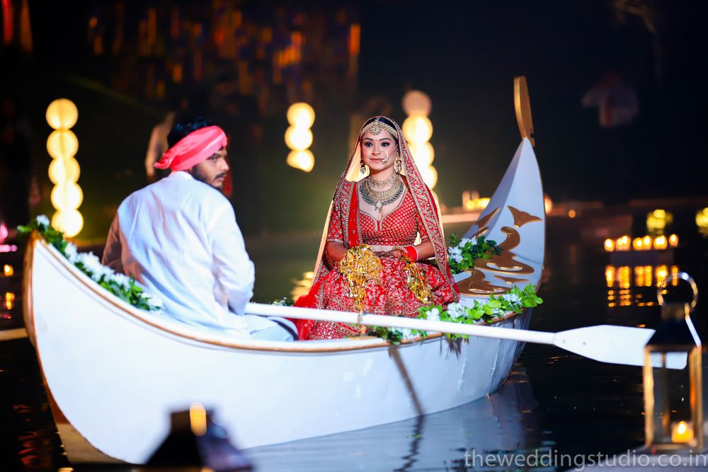 Photo of Bride entering venue on boat