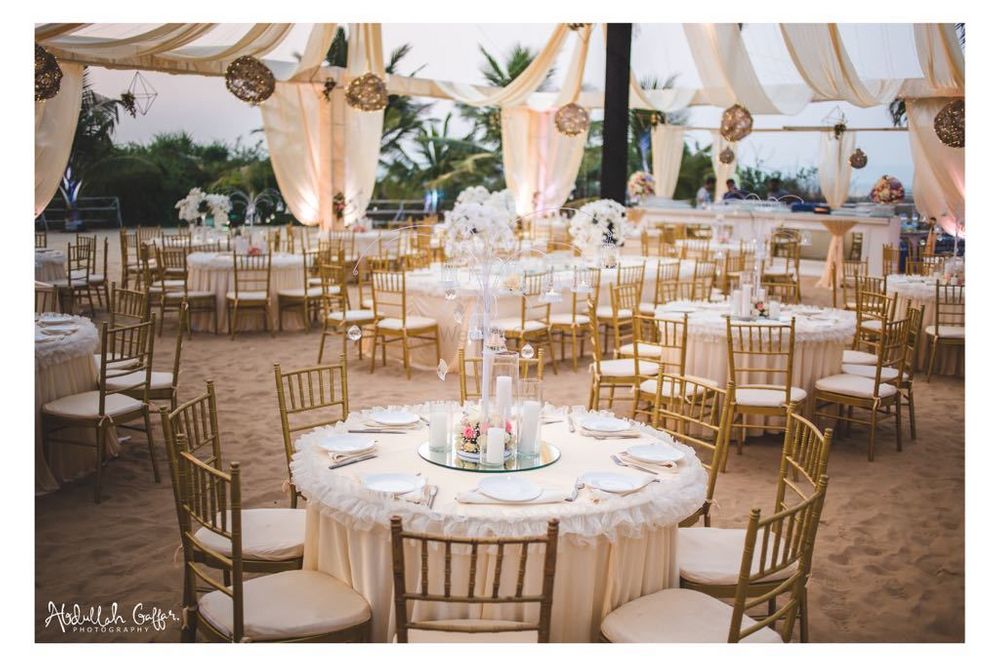 Photo of Round table setting  with gold and cream theme