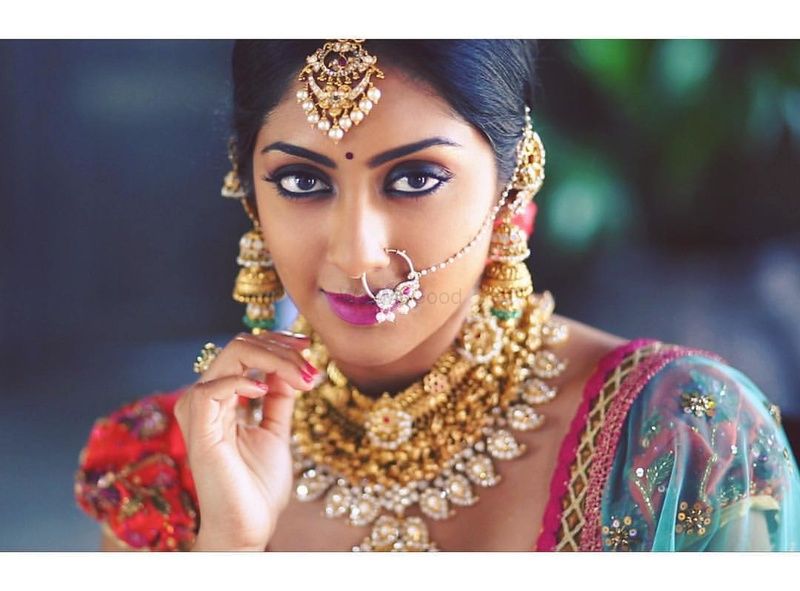 Photo of Mismatched bridal jewellery with gold and stones