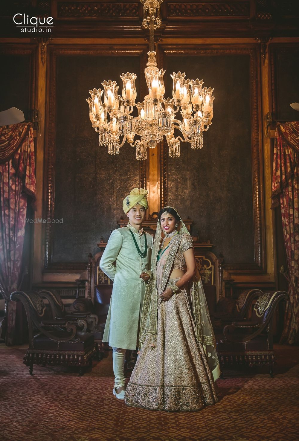 Photo of Coordinated bride and groom in mint and grey outfits