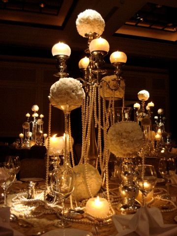 Photo of table centerpiece with candle and candlaabaras