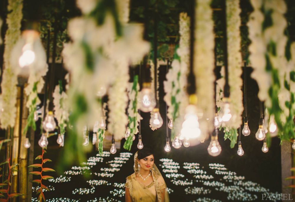 Photo of hanging floral strings and bulbs decor