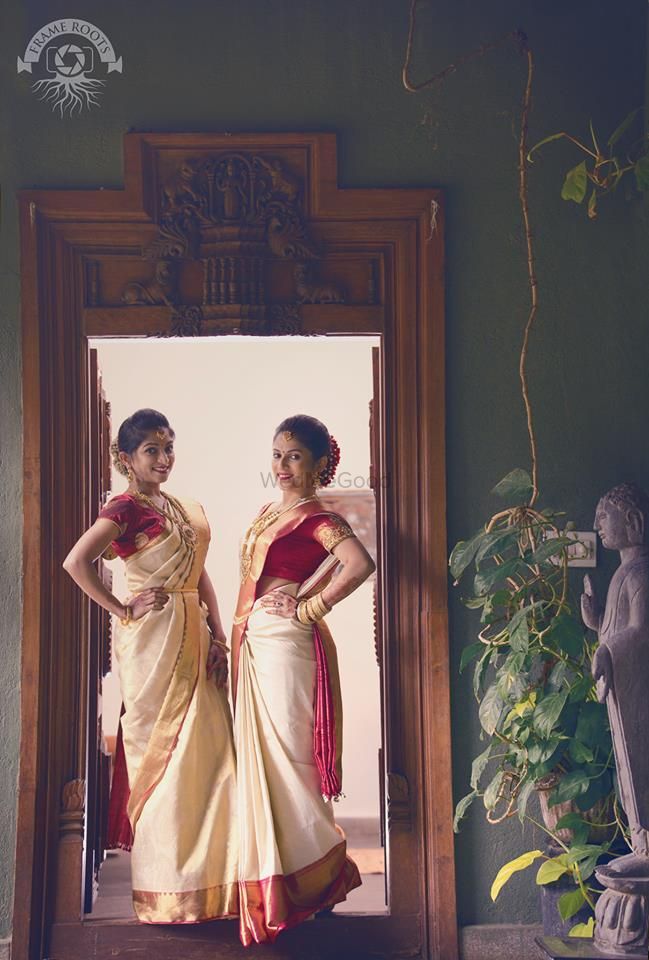 Photo of south indian bridesmaids wearing color-cordinated kanjivaram saree