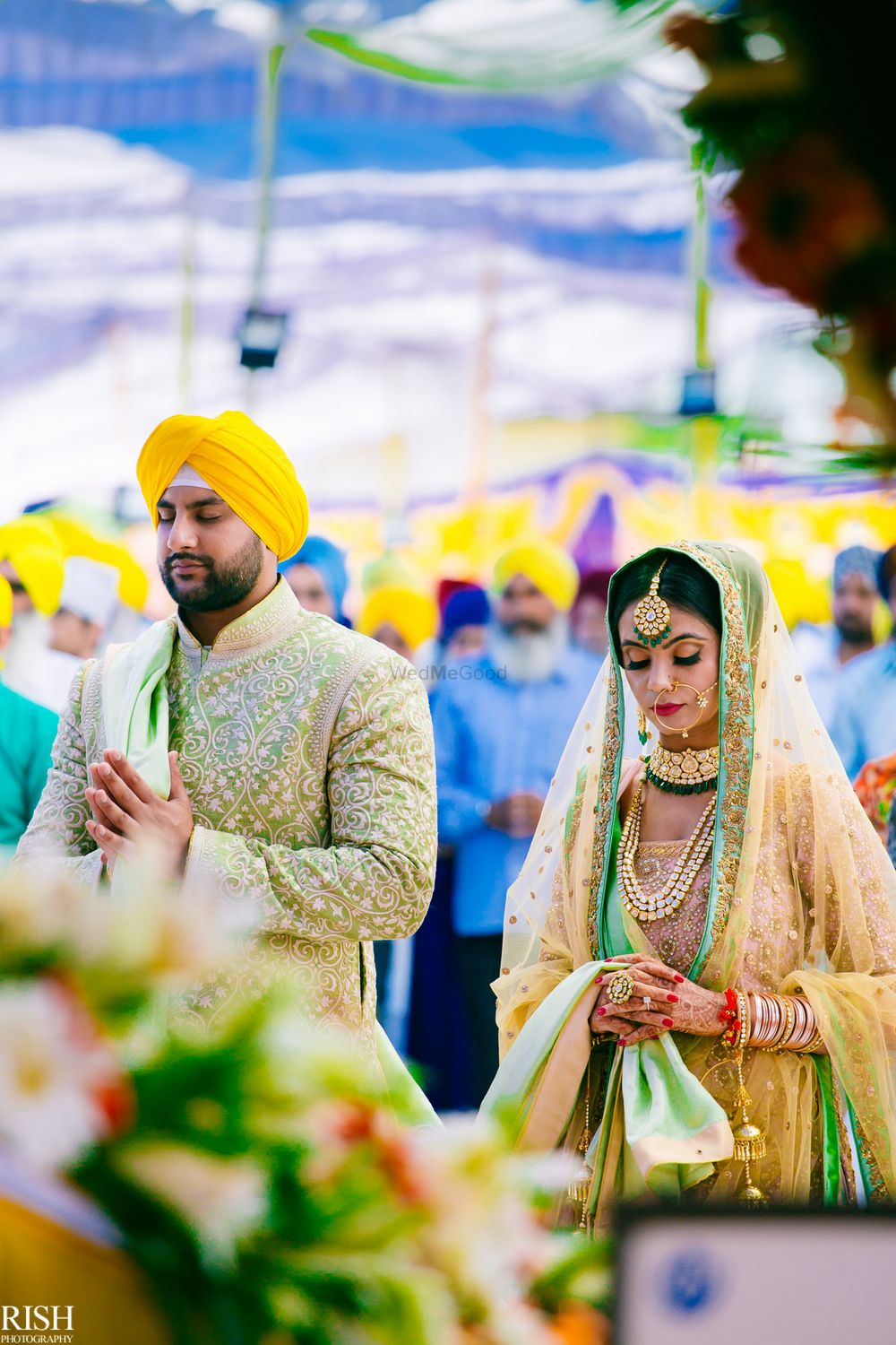 Photo of Sikh wedding with bride and groom in unique colours