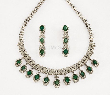 Photo of diamond and embellished green necklace and earrings