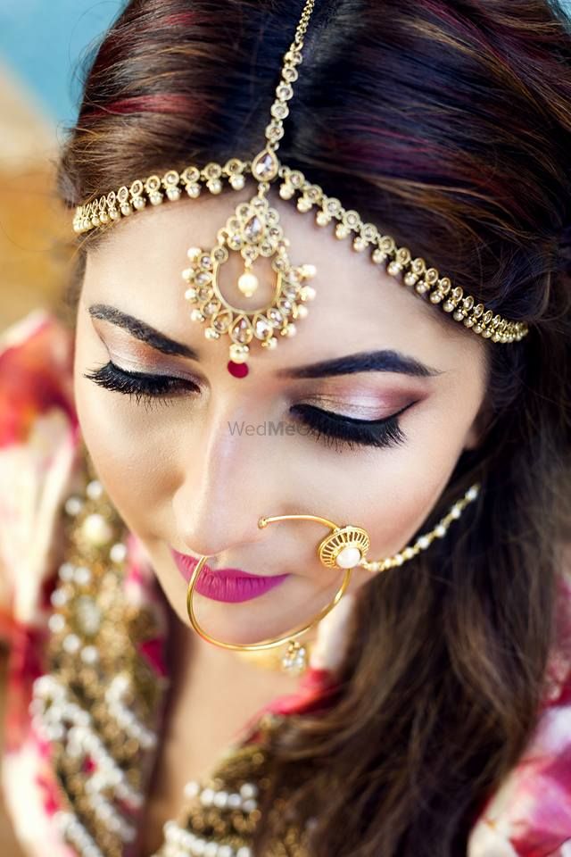 Photo of pink glitter eye bridal makeup