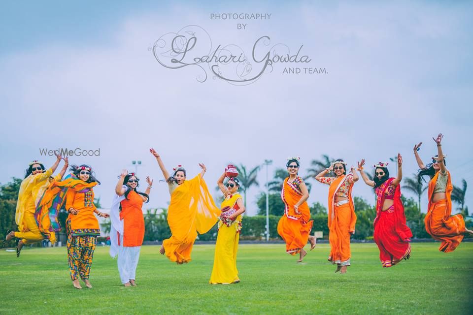 Photo of Matching bridesmaids jumping in the air