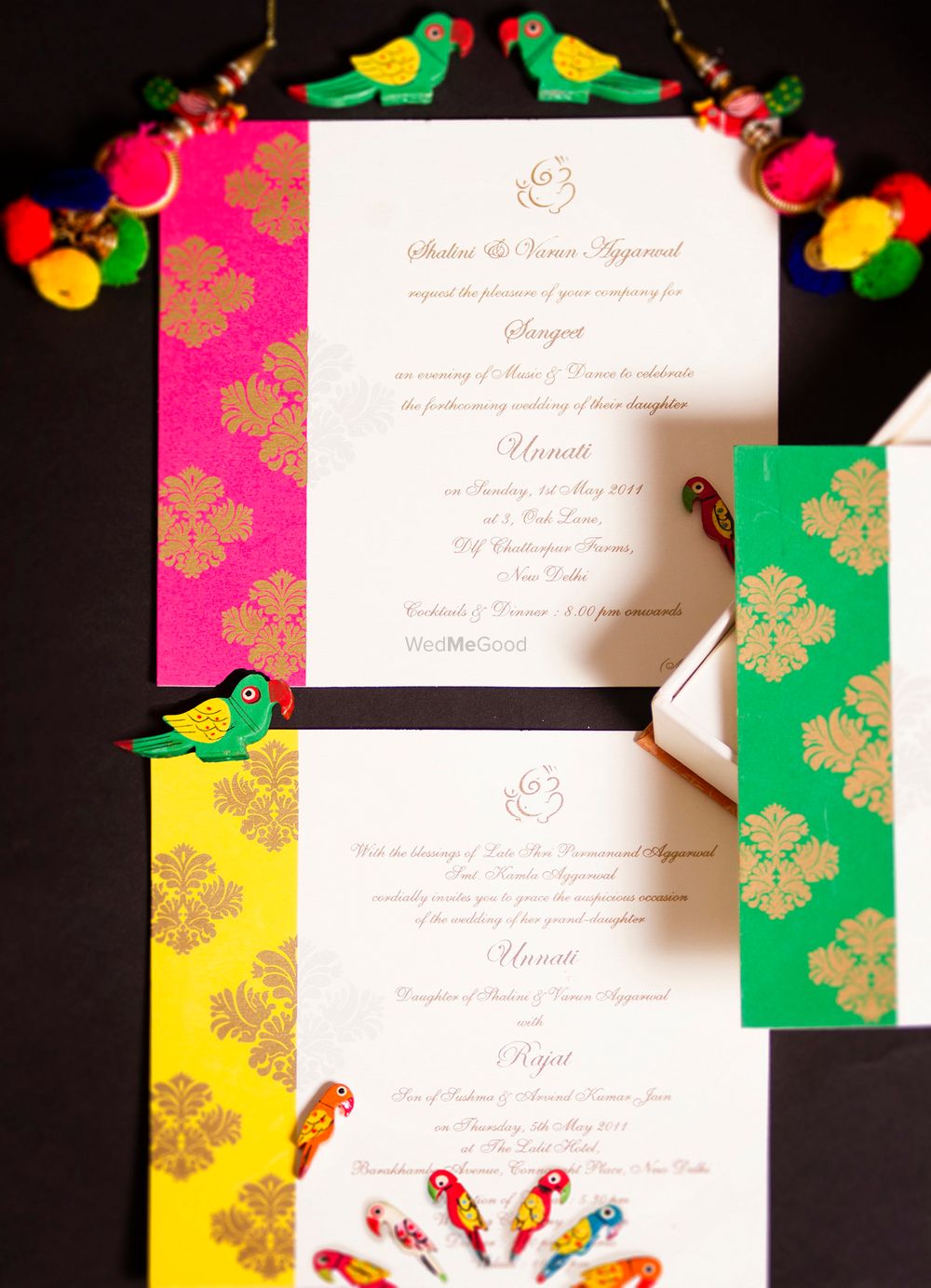 Photo of Colourful wedding invitation card with pompoms
