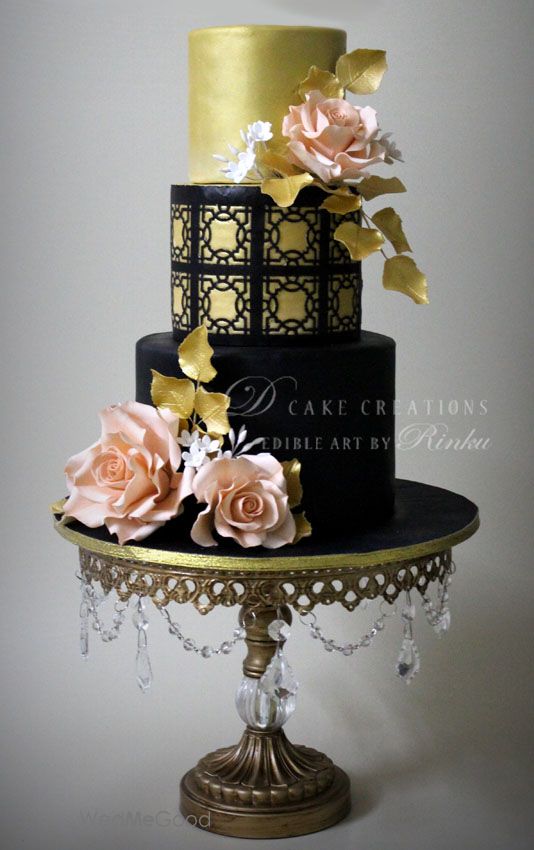 Photo of black and gold engagement cake