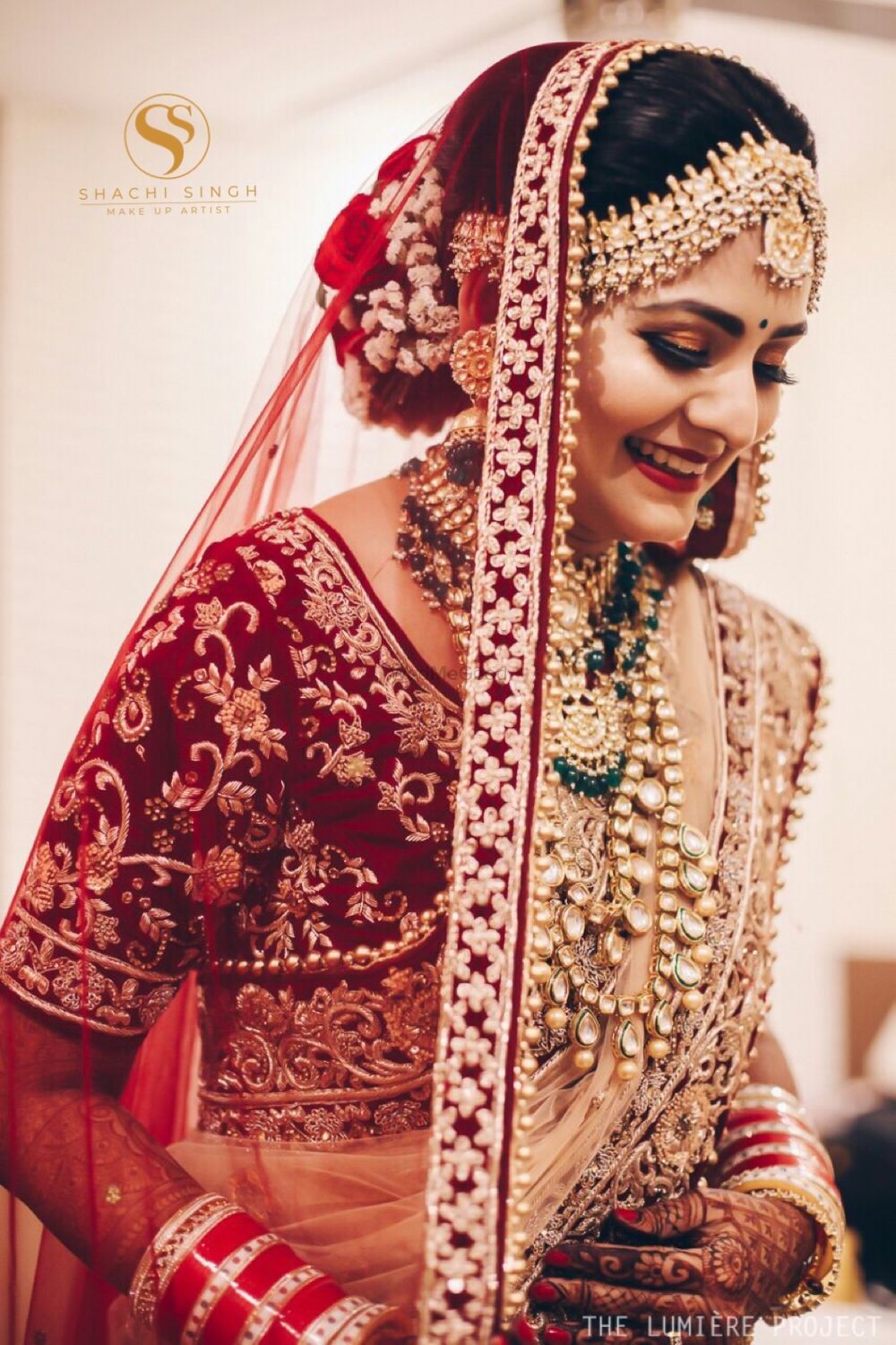 Photo of Gorgeous bride wearing maroon blouse with polki and emeralds jewelry